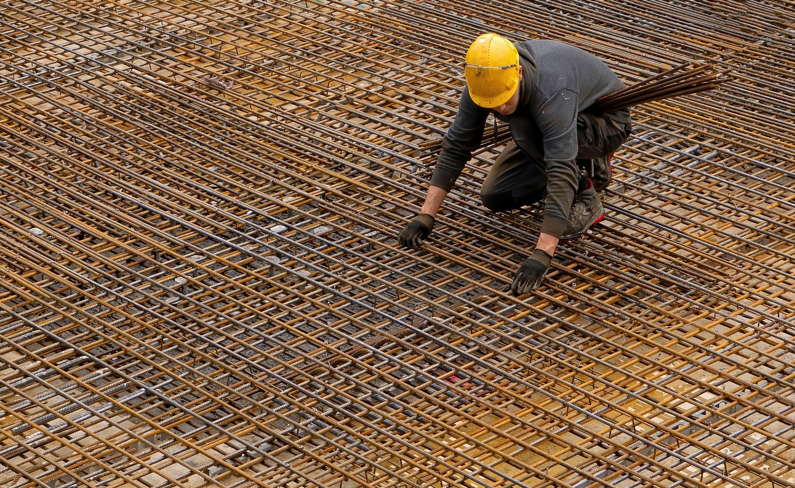 Concreter in a yellow hard hat on site